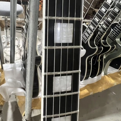 Disco personalizado de estilo GB Les Paul Guitarra eléctrica, cuerpo de caoba, tablero de fret de ébano, color negro, hardware dorado, unión de fret proveedor