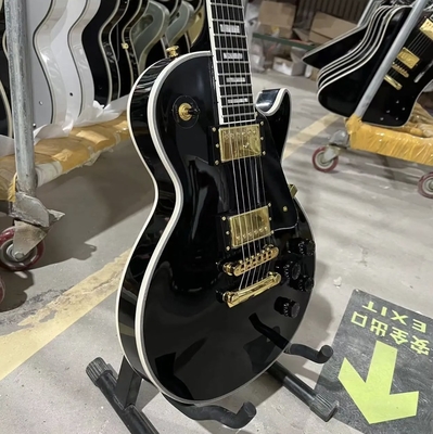 Disco personalizado de estilo GB Les Paul Guitarra eléctrica, cuerpo de caoba, tablero de fret de ébano, color negro, hardware dorado, unión de fret proveedor