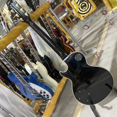 Disco personalizado de estilo GB Les Paul Guitarra eléctrica, cuerpo de caoba, tablero de fret de ébano, color negro, hardware dorado, unión de fret proveedor