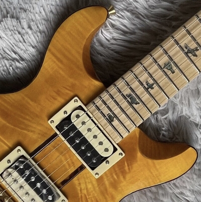 Guitarra eléctrica de color amarillo retrogrado de acero con tapicería superior HH Tremolo proveedor