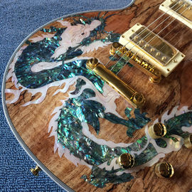 Nueva guitarra eléctrica LP de alta calidad, Abalone Dinosaur incrustada en el panel y el cuerpo de la guitarra eléctrica LP, gratis. proveedor