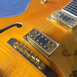 Guitarra eléctrica de jazz de cuerpo hueco de alta calidad, agujeros doble F, sistema de tremolo, tope de arce de llama proveedor