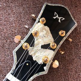 Guitarra eléctrica púrpura de diseño nuevo, con cáscara de mujer hermosa en el cuerpo, guitarras de 6 cuerdas, guitarra de alta calidad proveedor