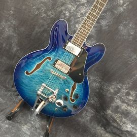 Concha semi hueca Archtop guitarra acolchada trans-azul con Bigsby proveedor