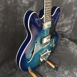 Concha semi hueca Archtop guitarra acolchada trans-azul con Bigsby proveedor