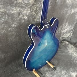 Concha semi hueca Archtop guitarra acolchada trans-azul con Bigsby proveedor