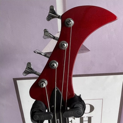 Guitarra de bajo eléctrica de 4 cuerdas personalizada con forma irregular de cuerpo especial en color rojo metálico Cuello de arce proveedor