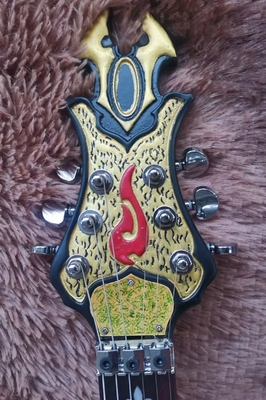 Guitarra eléctrica hecha a mano pintura colorida cabeza de cráneo de vaca cofetera proveedor