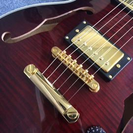 Guitarra eléctrica de nuevo estilo de alta calidad, agujeros de doble F, tablero de madera de rosa proveedor