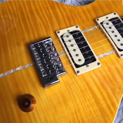 Guitarra eléctrica a medida con incrustación de pájaro y hardware de cromo en amarillo PRS Santana Retro Orange proveedor