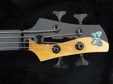 4 cuerdas de bajo Fodera bajo personalizado Alder con el cuerpo de diseño Taiji logotipo de incrustación MOP proveedor