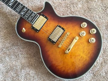 LP guitarra personalizada tabaco solar estallido cuerpo de arce acolchado contorno de espalda y contorno de la articulación del cuello guitarra personalizada tablero de ébano proveedor
