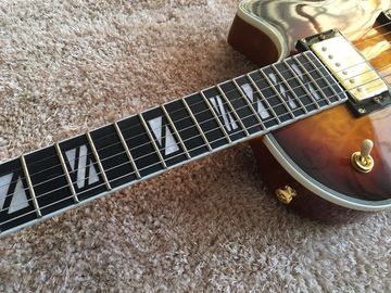 LP guitarra personalizada tabaco solar estallido cuerpo de arce acolchado contorno de espalda y contorno de la articulación del cuello guitarra personalizada tablero de ébano proveedor