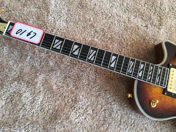 LP guitarra personalizada tabaco solar estallido cuerpo de arce acolchado contorno de espalda y contorno de la articulación del cuello guitarra personalizada tablero de ébano proveedor