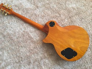 LP guitarra personalizada tabaco solar estallido cuerpo de arce acolchado contorno de espalda y contorno de la articulación del cuello guitarra personalizada tablero de ébano proveedor