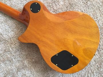LP guitarra personalizada tabaco solar estallido cuerpo de arce acolchado contorno de espalda y contorno de la articulación del cuello guitarra personalizada tablero de ébano proveedor