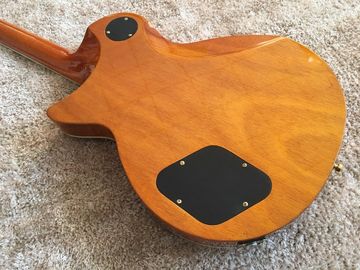 LP guitarra personalizada tabaco solar estallido cuerpo de arce acolchado contorno de espalda y contorno de la articulación del cuello guitarra personalizada tablero de ébano proveedor