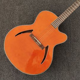 Guitarra de 6 cuerdas de color naranja, espalda roja y lateral, pickup lateral, cuerpo hueco proveedor